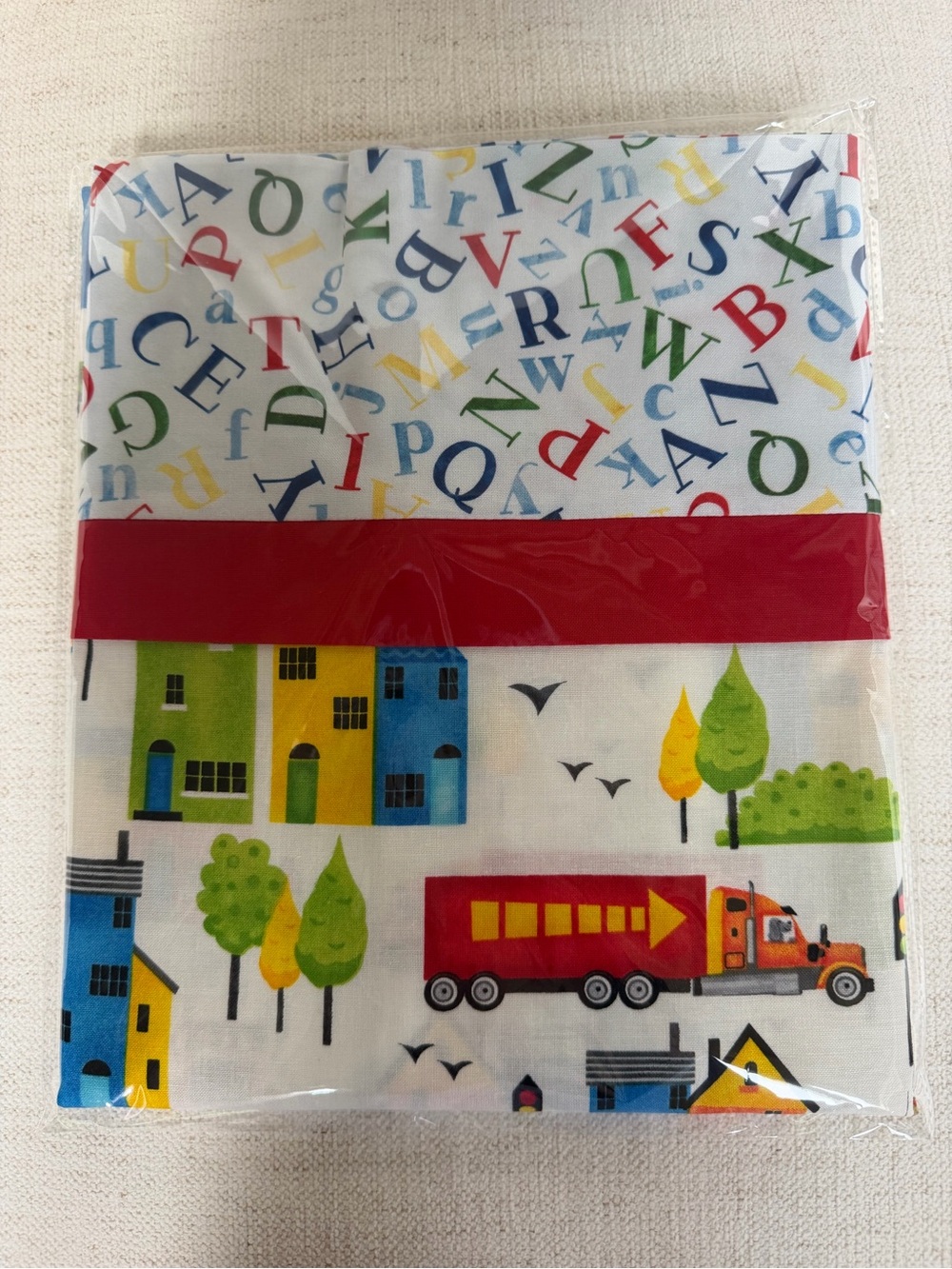 NEW and UNUSED child’s specialty pillowcase. Bright and colorful. Quality fabric